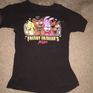 Freddy Fazbears Pizza shirt.